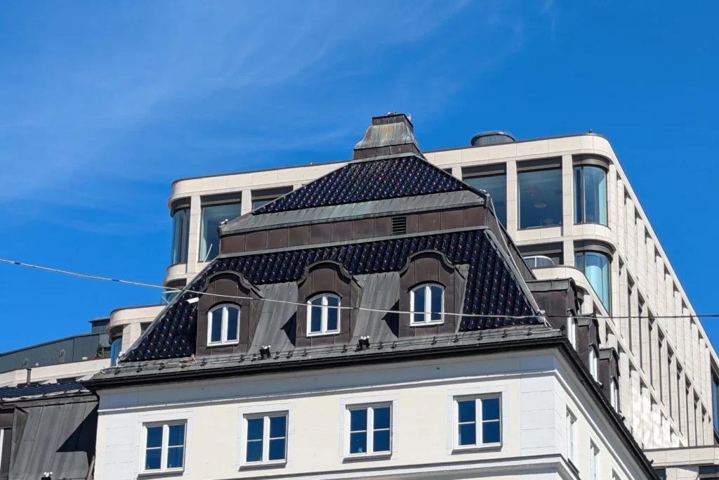 Rooftops of Universitetsgata 11 and 1-9 with blue skies, Oslo 2024, by Tobias Rade Evensen